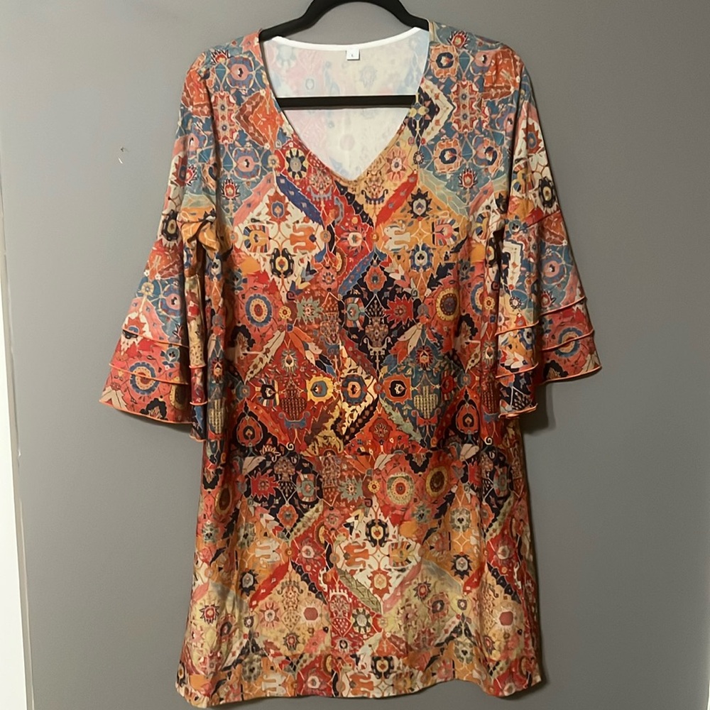 Beautiful and bold bell sleeved dress